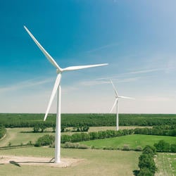 wind turbines over fields (c) Thomas Reaubourg unsplash