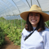 student in a greenhouse